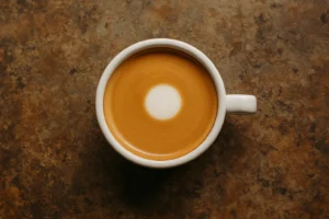 flat white sitting on a rustic table.