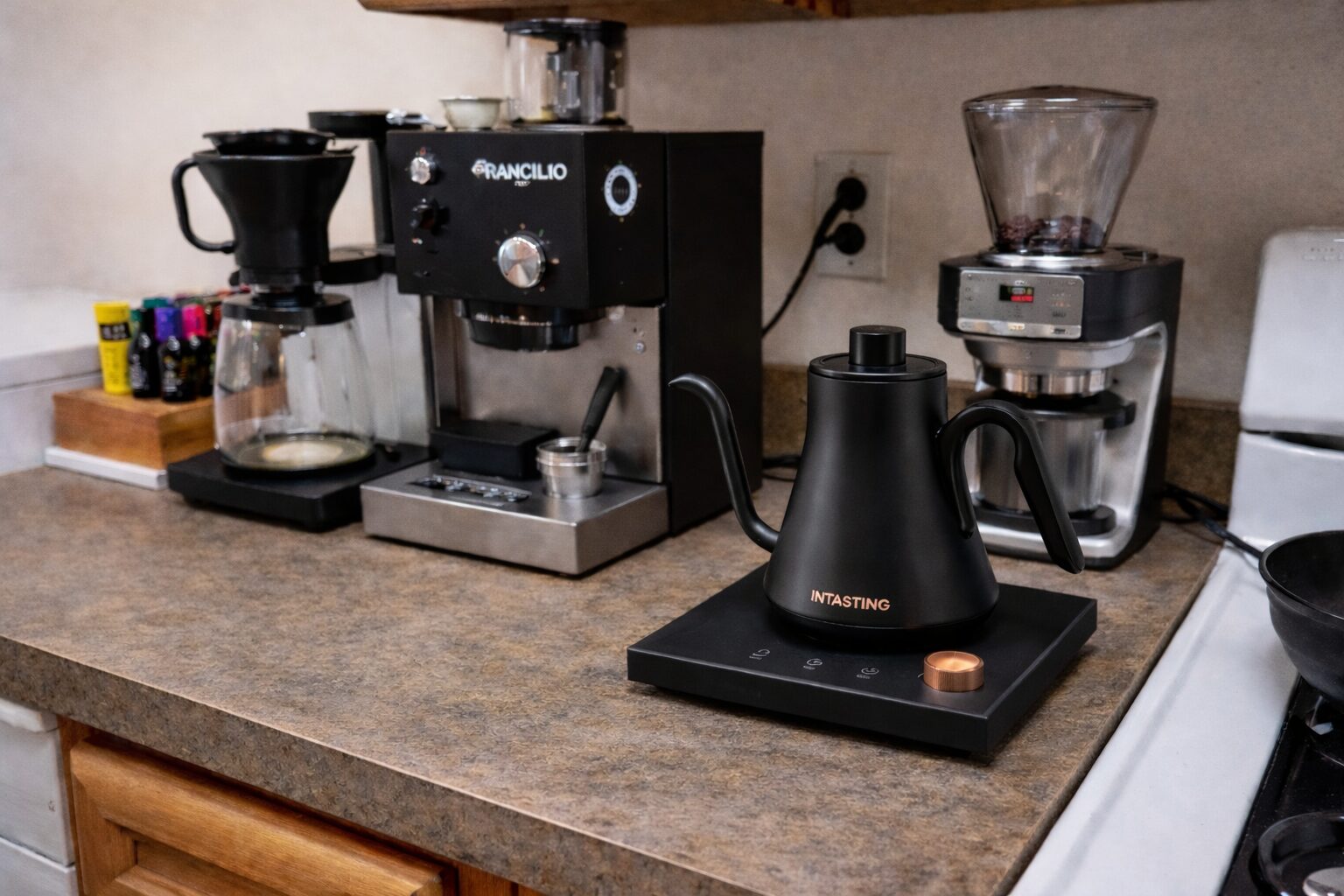 INTASTING gooseneck electric kettle on kitchen counter showing LED temperature display