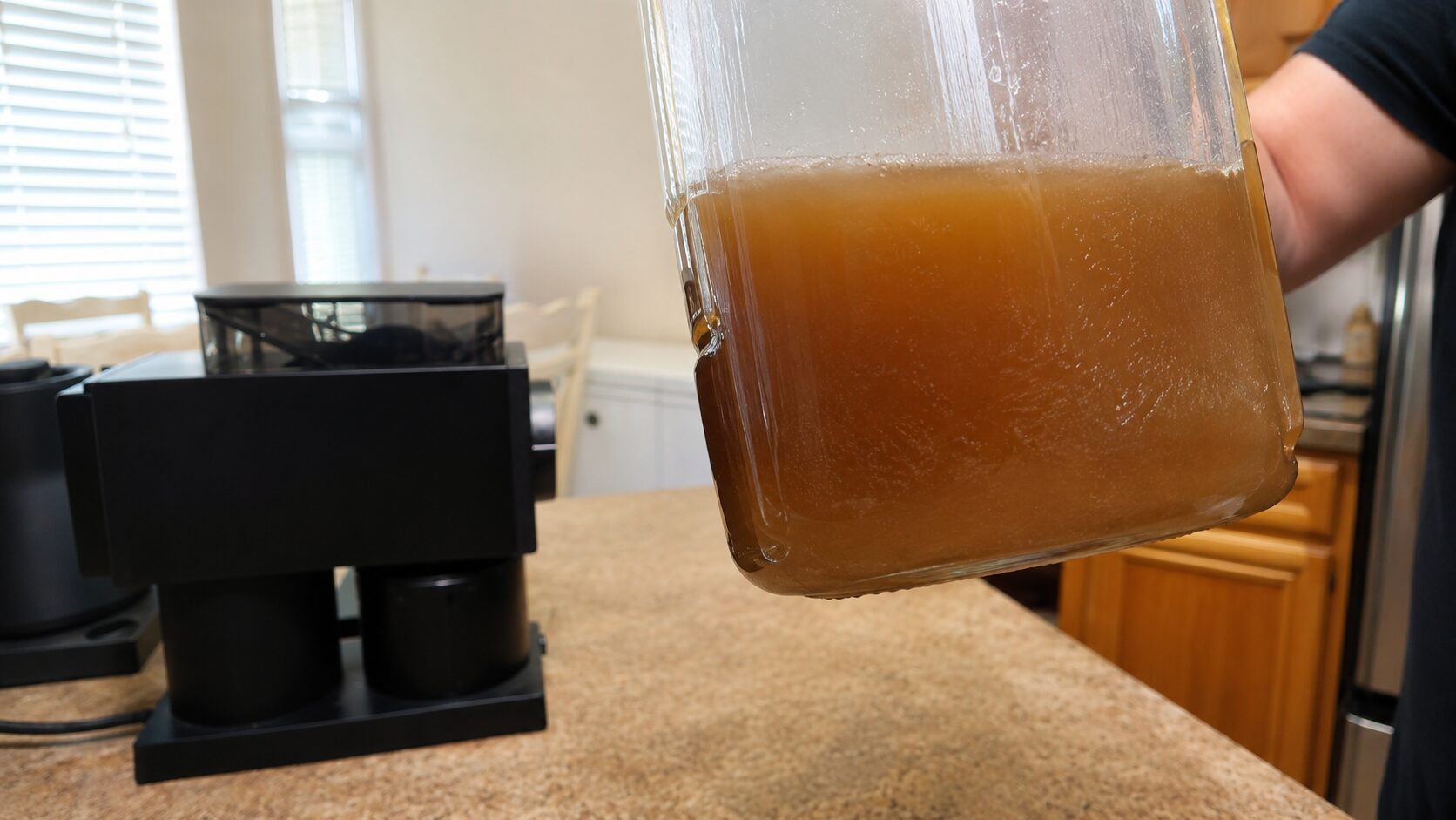 Finished cloudy homemade pistachio syrup in a glass jar