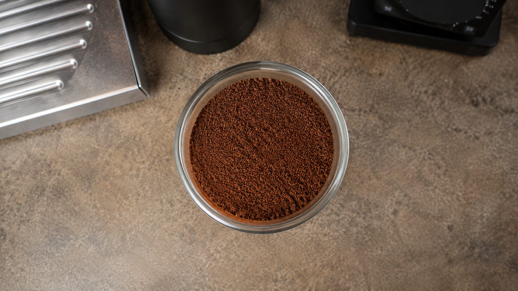 Close-up of uniform espresso grounds from the 1Zpresso J-Ultra