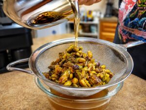 straining the pistachio syrup